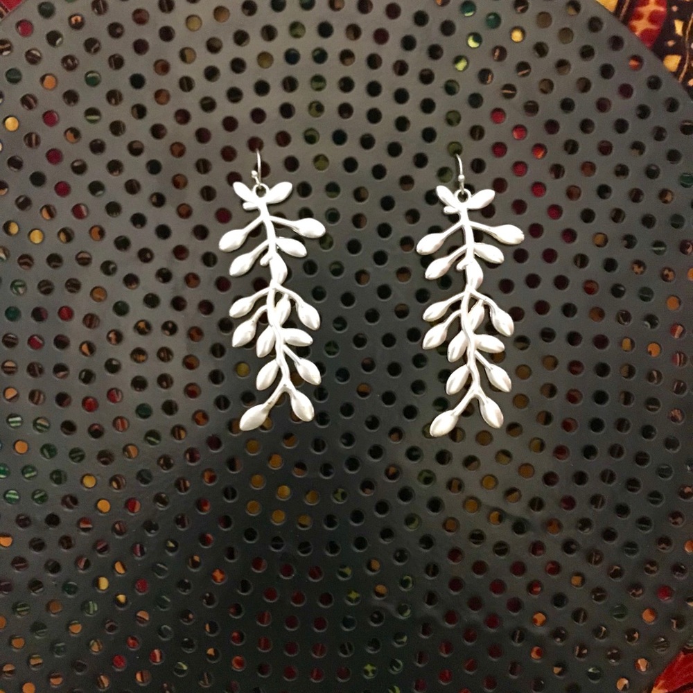 Silvertone ornate earrings.